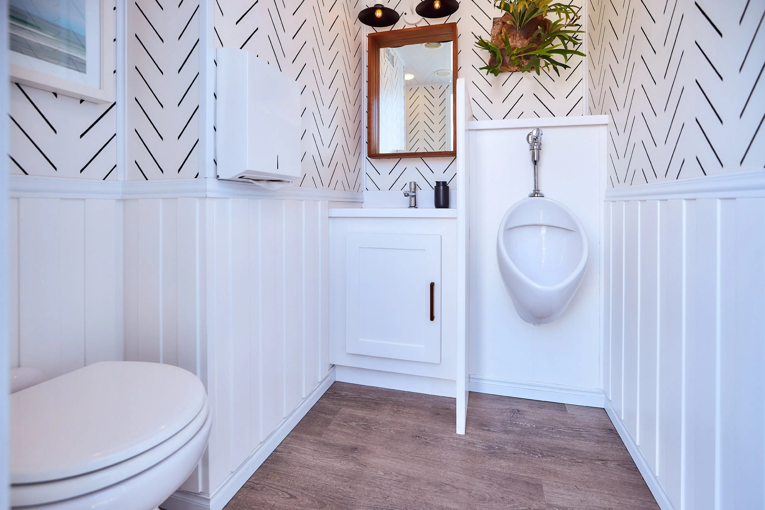 Coastal Modern men's restroom wide view